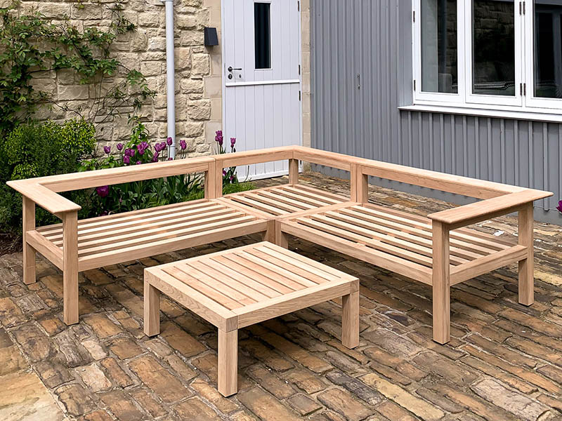 Corner garden bench with matching table